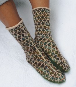 Fair Isle Trellis - The technique used here for the diamond trellis is two-color stranding, aka Fair Isle. The trellis lines arc gracefully up the leg from the sole and form half-stars over the toe.